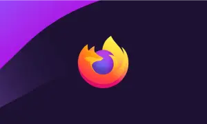 Logo Firefox w gradientach pomarańczu i żółci, otaczające fioletową kulę. Tło ciemnofioletowe z fioletowym pasem. Symbolizuje firefox aktualizacja.