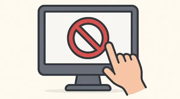Monitor z symbolem zakazu i palcem wskazującym, symbolizującym blokowanie stron internetowych.