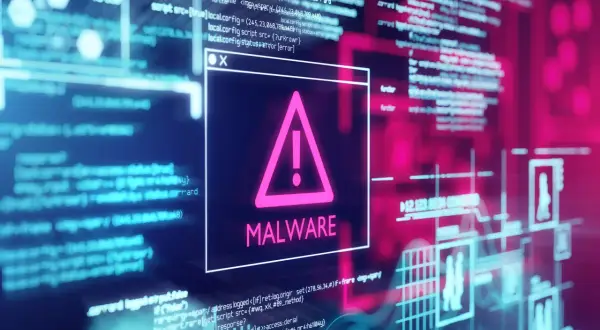 Okno z ostrzeżeniem o zagrożeniu MALWARE. W tle widać kod i schematy, sugerujące jak usunąć malware.