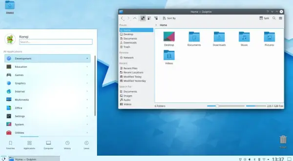 Widok pulpitu z menedżerem plików Dolphin, prezentujący środowisko KDE Plasma 5. Widoczne foldery i pasek zadań.