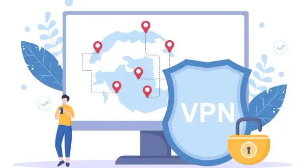 Osoba korzysta z telefonu, a na ekranie komputera widać mapę z lokalizacjami i tarczę z napisem VPN.