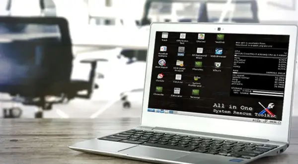 Laptop z uruchomionym systemem **System Rescue** CD. Na ekranie widoczne ikony narzędzi do naprawy systemu i diagnostyki.