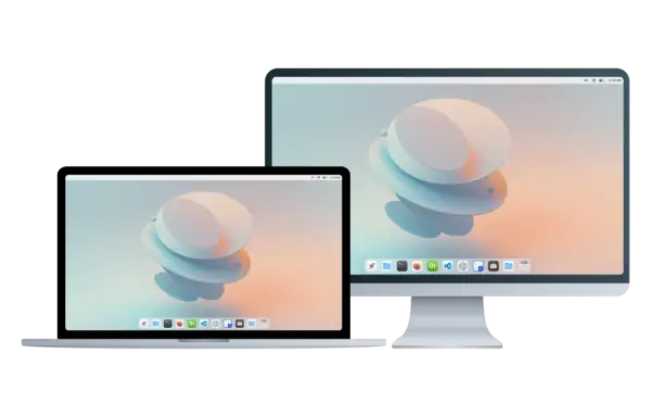 Laptop i monitor z tapetą w stylu cutefish os.