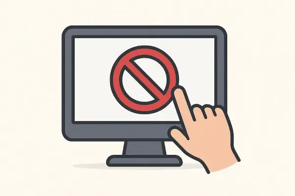 Monitor z symbolem zakazu i palcem wskazującym, symbolizującym blokowanie stron internetowych.